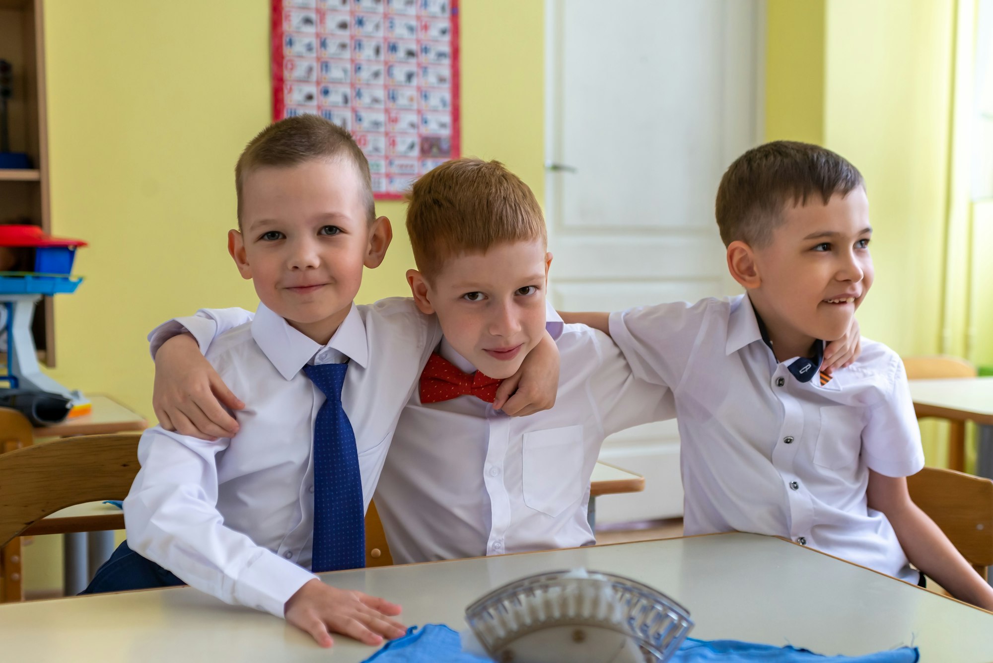 Graduation in kindergarten, holiday. Group of friends. Well-dressed children, boys laughing at party